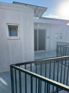 a balcony of a house with a door at Marisa Napa Suites Ayia Napa in Ayia Napa +10 photos