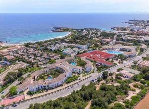an aerial view of a resort next to the ocean at Sol Falco Menorca in Son Xoriguer