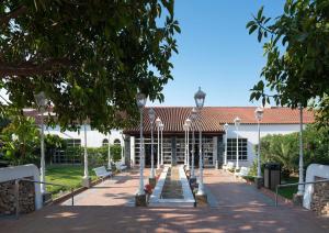 a courtyard of a building with a row of lights at Sol Falco Menorca in Son Xoriguer