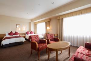 Postel nebo postele na pokoji v ubytování Dai-ichi Hotel Ryogoku