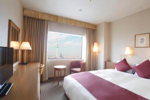 Postel nebo postele na pokoji v ubytování Dai-ichi Hotel Ryogoku