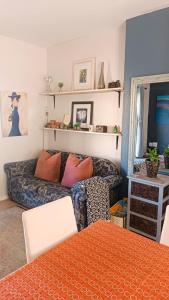 a living room with a couch and a table at Creative 2 Level Townhouse Near City and Wine Route in Brackenfell +25 photos