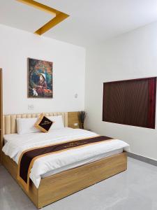 Ένα ή περισσότερα κρεβάτια σε δωμάτιο στο Vọng Home