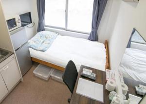 Ένα ή περισσότερα κρεβάτια σε δωμάτιο στο ドリームビレッジエンシン