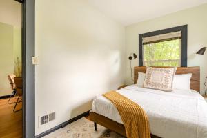 a bedroom with a bed and a window at Stay Portland - Moab Vibes in PDX- Walk to Local Coffee & Food in Portland +22 photos