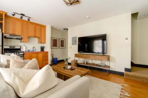 a living room with a couch and a table at Stay Portland - The Little Tower - Local Vintage Shops & Eateries in Portland