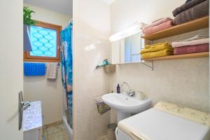 a small bathroom with a sink and a toilet at La petite maison a la campagne in Nantheuil +22 photos