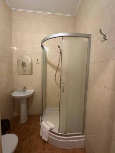 a bathroom with a shower and a sink at Delta in Kyiv