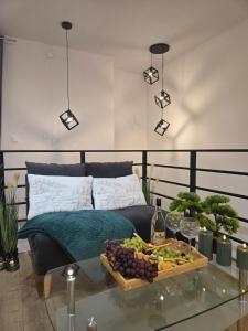 a living room with a glass table with a tray of fruit at Leśny Zakątek I Małe Bieszczady w Rzeszowie I grill sauna Starowiejska 6 Rzeszów in Rzeszów