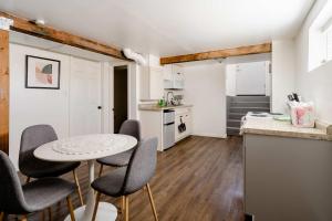 a kitchen with a table and chairs in a room at Cozy Portland Home Steps from Food - Sleeps 4 in Marquam Hill