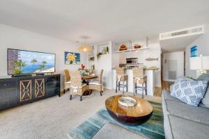 a living room with a couch and a table at Kaanapali Shores 725 · KS 725 2BD in BeachFront Resort w Ocean V in Kahana