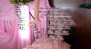 a display of pink cupcakes on a pink wall at Qingdao Donghai Hotel in Qingdao