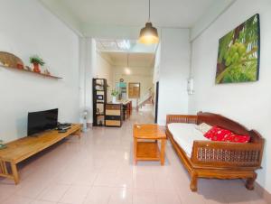 a living room with a couch and a table at house 1 for 6 paxs whole house 3 beds in Hat Yai