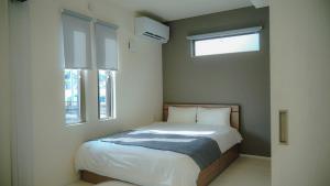 Ένα ή περισσότερα κρεβάτια σε δωμάτιο στο Opt熊本益城