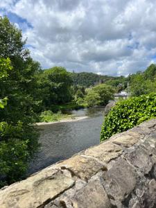 a view of a river from a stone bridge at Camping Floreal La Roche-en-Ardenne in La Roche-en-Ardenne