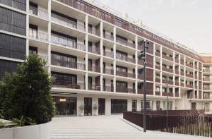 an apartment building with a courtyard in front of it at My Home is Yours in Porto