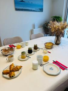 a table with plates of food on it at Ti Marie Ly in Audierne +31 photos