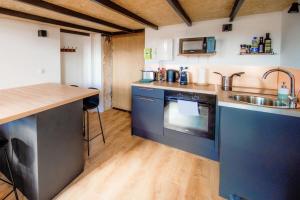 a kitchen with a sink and a stove top oven at The Little Dumont - 2-person Apartment - Croix-Rousse in Lyon
