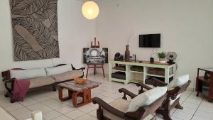 a living room with a couch and a tv at Family Retreat Holiday Home in Margate