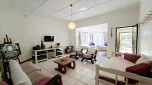 a living room with a couch and a table at Family Retreat Holiday Home in Margate