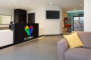 a lobby with a kong sign and a couch at The Ascent in Liverpool