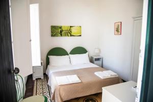 Ένα ή περισσότερα κρεβάτια σε δωμάτιο στο Antico Giardino Salentino