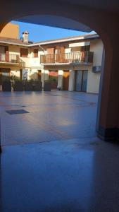 an empty parking lot in front of a building at Otto House short stay with style in San Daniele del Friuli