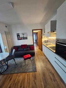 a living room with a couch and a table at Rubin Stay-Karabas Apartments in Vicenza