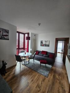 a living room with a couch and a table at Rubin Stay-Karabas Apartments in Vicenza