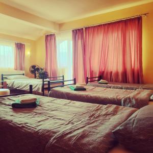 Ένα ή περισσότερα κρεβάτια σε δωμάτιο στο Family or Friends Room