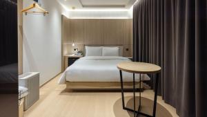 Una cama o camas en una habitación de 하운드 호텔 포항 영일대점 116 fotos más