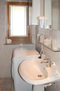 a bathroom with a sink and a mirror at Case Gran Paradiso Rhemes Saint Georges Voix in Rhemes-Saint-Georges +16 photos