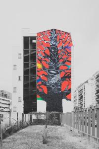 a mural on the side of a building at 1.75 Paris Le Charme in Paris