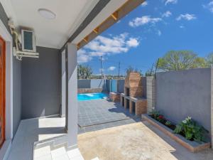 a view from the patio of a house with a swimming pool at Kuhle Guesthouse in Kempton Park