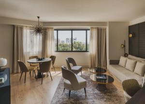 a living room with a couch and a table at Catalonia Molina Lario in Málaga