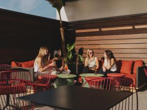 a group of women sitting at tables in a restaurant at Molina Lario in Málaga +56 photos