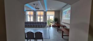 a meeting room with chairs and a table in a building at Willa Wierzbiczany in Gniewkowo