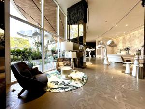 a living room with a couch and chairs and a table at Luxury apt in Panama City 2 Rooms 3 Baths office in Panama City