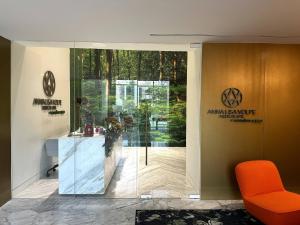 a lobby with an orange chair and a glass door at Luxury apt in Panama City 2 Rooms 3 Baths office in Panama City +29 photos