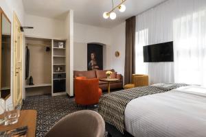 Ένα ή περισσότερα κρεβάτια σε δωμάτιο στο Hotel Palladian +44 φωτογραφίες