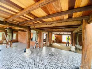 a building being remodeled with a wooden ceiling at The wooden house, peaceful place in Nhon Trach IoStayhome in Kon Rung (1)