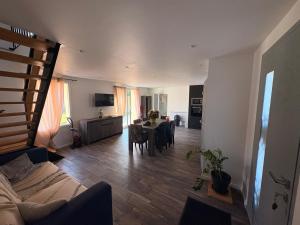 a living room with a table and a dining room at Le nid D Angel in Criel-sur-Mer