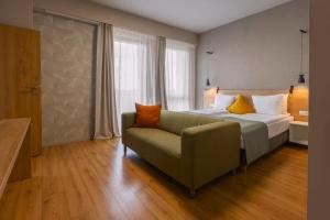 Postel nebo postele na pokoji v ubytování Marida Hotel