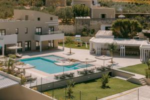 an aerial view of a resort with a swimming pool at Anassa Villa, with 110m2 Pool, Emerald Gardens, Wellness & Sports, By ThinkVilla 
