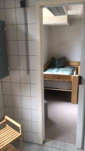 a small bedroom with a bunk bed in a room at Harzbett in Sinsleben