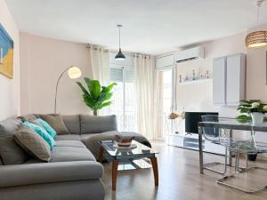 a living room with a couch and a glass table at Apartment Sunset in Cunit