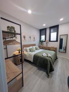 Ένα ή περισσότερα κρεβάτια σε δωμάτιο στο Apartamento Turistico NC