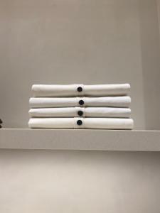 a stack of white towels sitting on a shelf at R Zajad Witnica in Witnica
