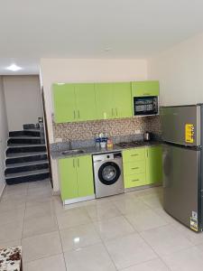 Kuchyň nebo kuchyňský kout v ubytování Tiba Golden Resort