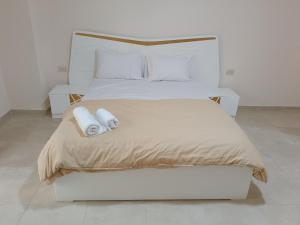 Postel nebo postele na pokoji v ubytování Tiba Golden Resort + 56 fotografií